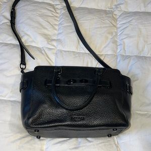 All black coach bag. Has wear and tear. Defiantly used condition.